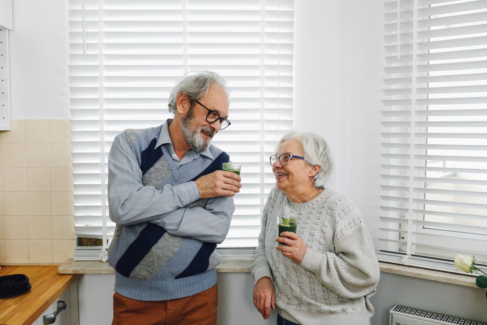 An older couple reviewing a policy document at home